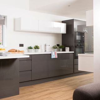 while colour kitchen with black drawers and white cabinet