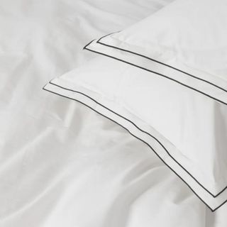 A white duvet and two white pillows from McGee & Co.