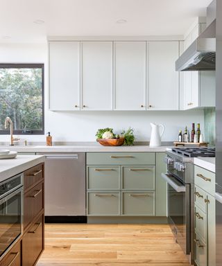 Green and white kitchen cabinets