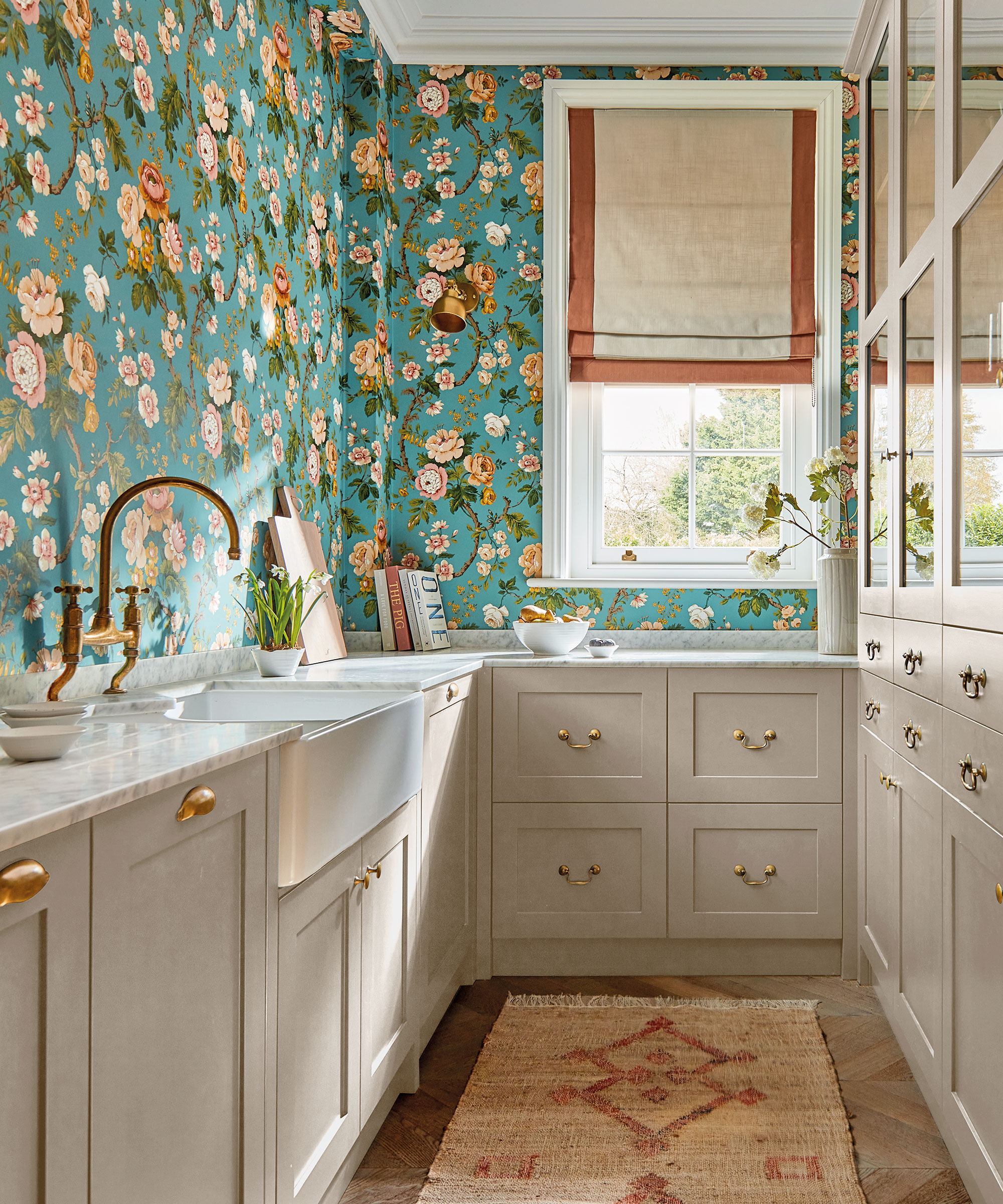 narrow while Shaker utility room with blue floral wallpaper