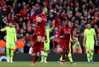 Jordan Henderson and Divock Origi celebrate Liverpool's first goal in their 4-0 win over Barcelona at Anfield in the Champions League semi-finals in May 2019.