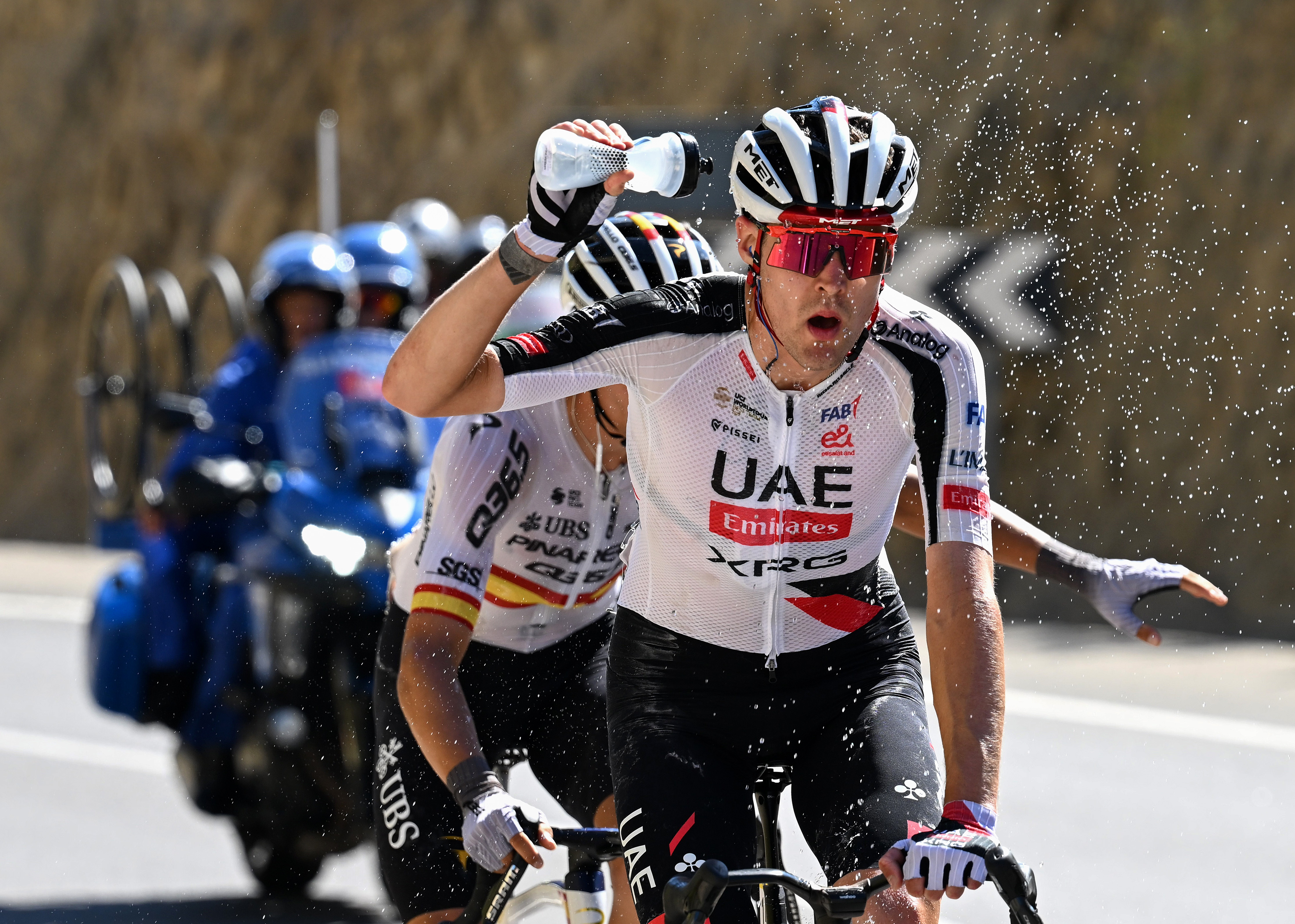 Pavel Sivakov (UAE Team Emirates-XRG) tries to cool himself down