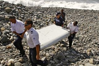Debris from Flight MH370 is recovered from a beach