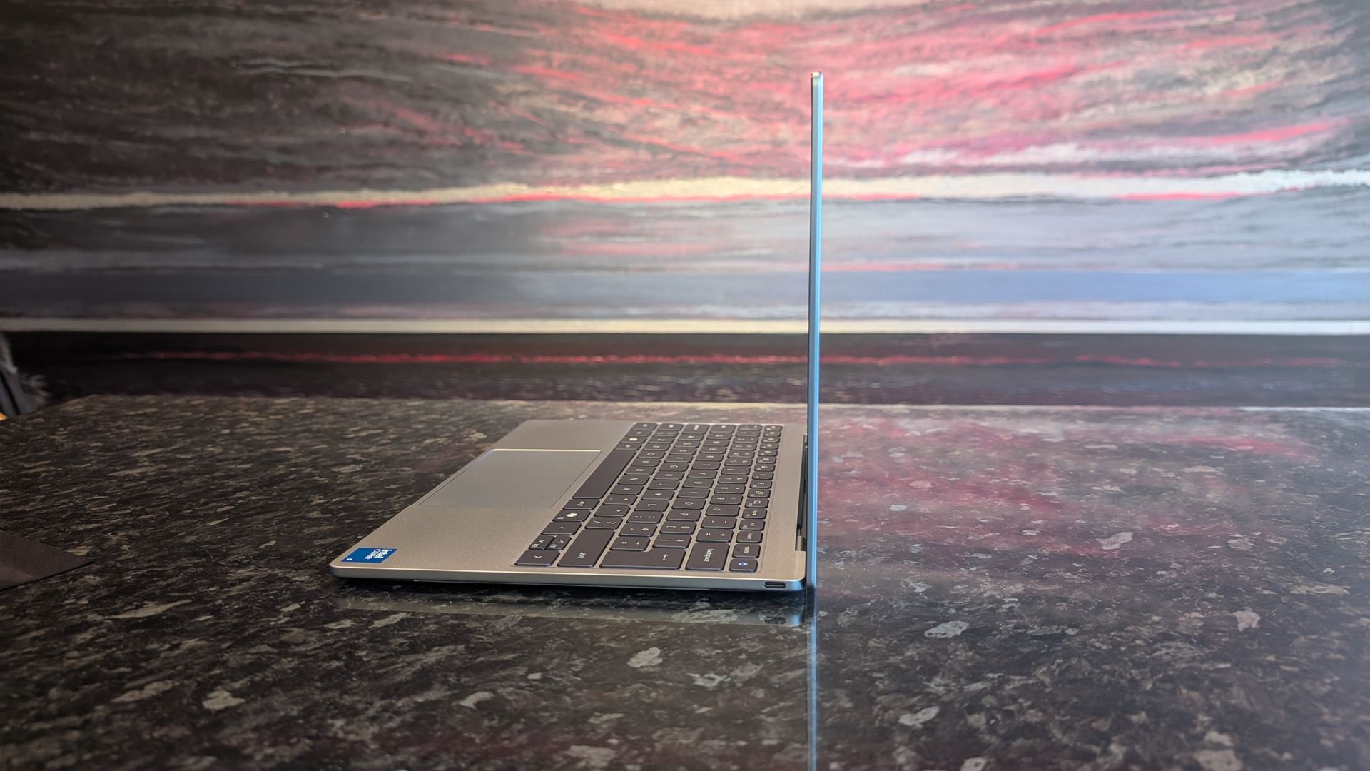 The Dell XPS 13 (2026) laptop pictured on a black marble worktop.