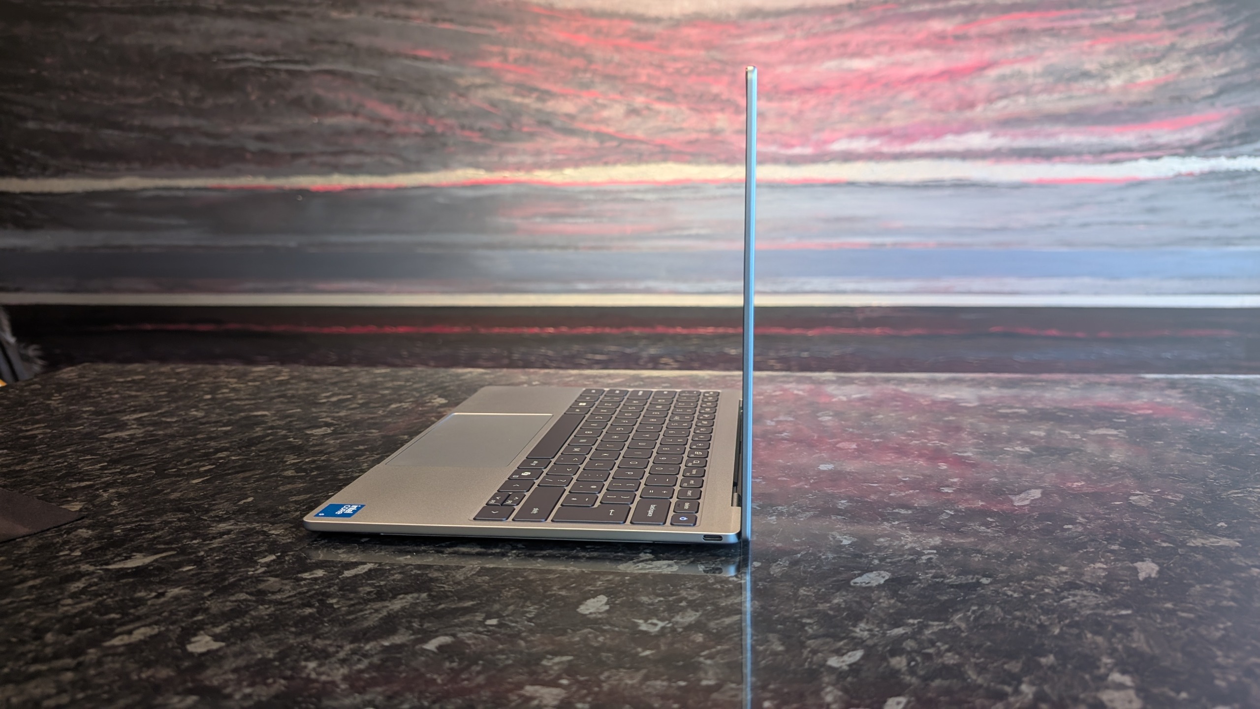 The Dell XPS 13 (2026) laptop pictured on a black marble worktop.