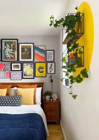A bedroom with a wall with yellow paint effect