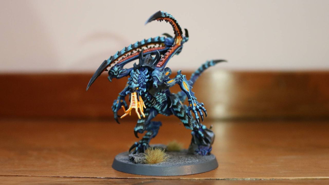 New Tyranid Lictor model on a wooden table