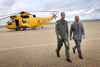 King Charles and Prince William, Duke of Cambridge visit the RAF Rescue helicopter at RAF Valley on July 9, 2012.