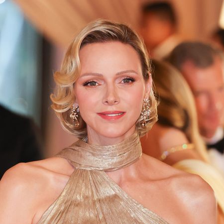 Princess Charlene wears a custom shimmering gold gown from Elie Saab, channeling her late mother-in-law Grace Kelly