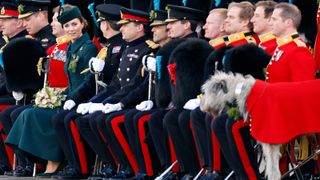 Catherine, Duchess of Cambridge poses for a group photograph with soldiers of the Irish Guards as she attends the annual St. Patrick's Day parade at Mons Barracks on March 17, 2022 in Aldershot, England
