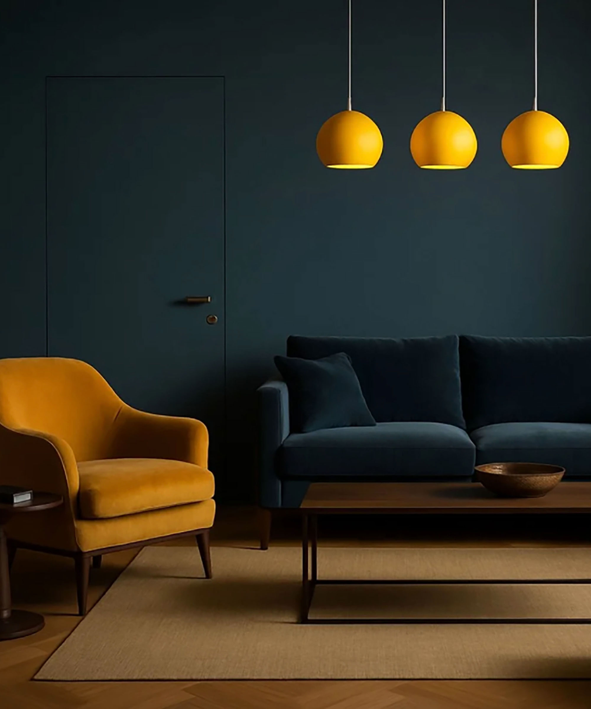 living room with dark blue walls and door, blue velvet sofa, yellow velvet armchair and three yellow pendant lights