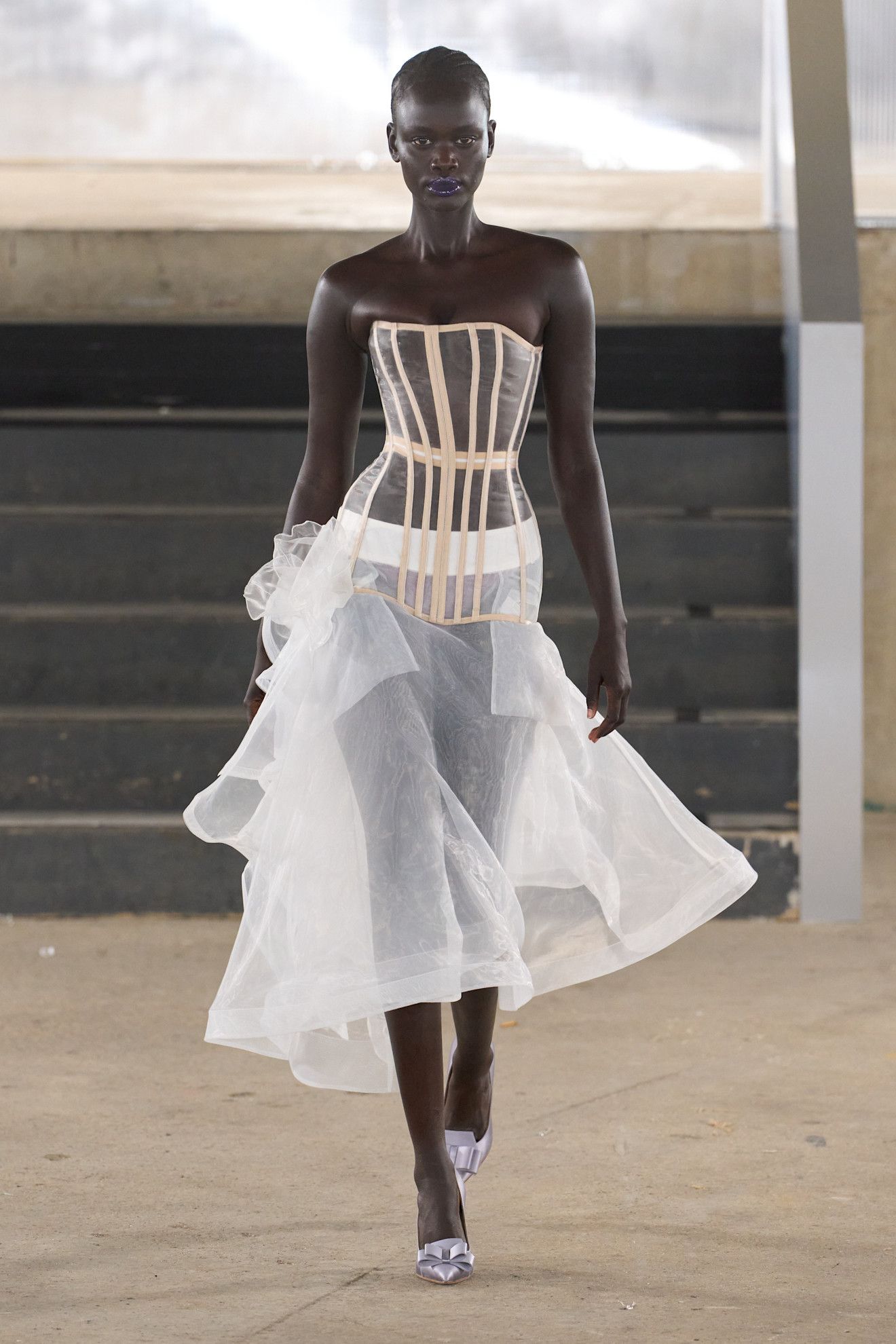 Runway image of a model walking in the Agro Studio show at London Fashion Week spring/summer 2027
