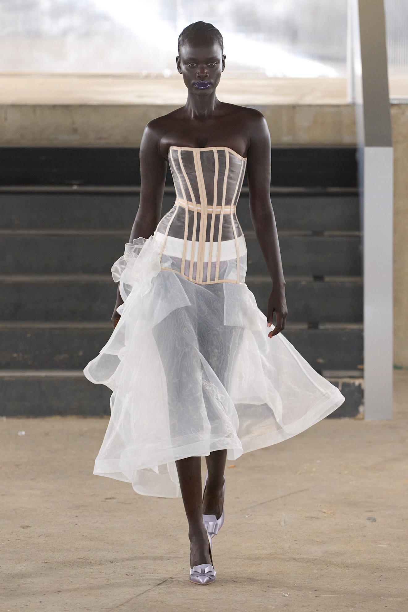 Runway image of a model walking in the Agro Studio show at London Fashion Week spring/summer 2027