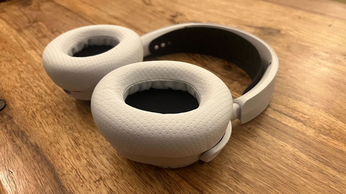 The SteelSeries Arctis Nova 7X Wireless lying flat on a wooden table.