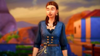 The Sims 4 Crystal Creations trailer screenshot showing a woman with shoulder-length brown hair and a blue buttoned-up dress smiling