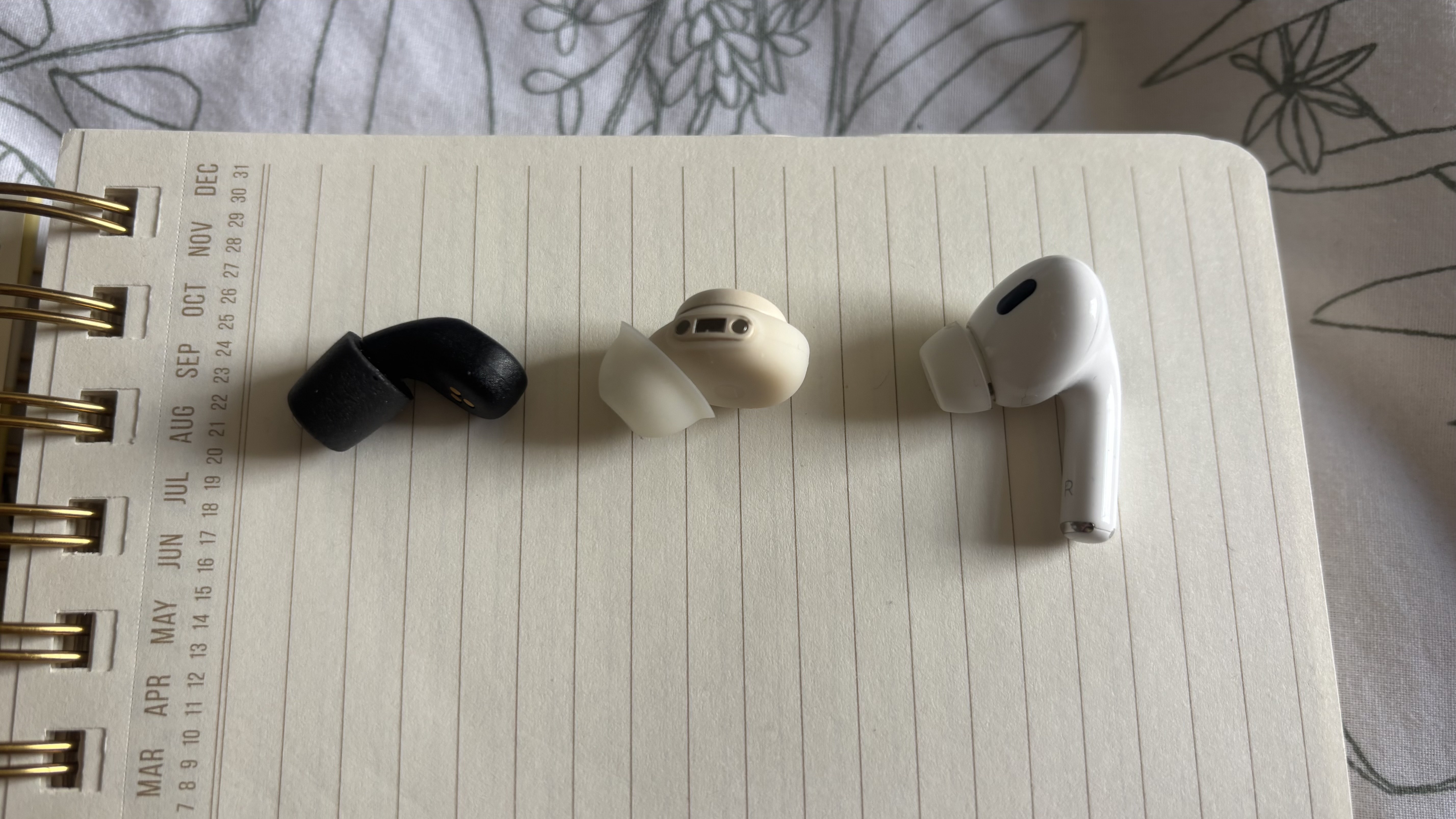A size comparison of the QuietOn 4, the Fitnexa SomniPods 3, and the AirPods Pro 2. 