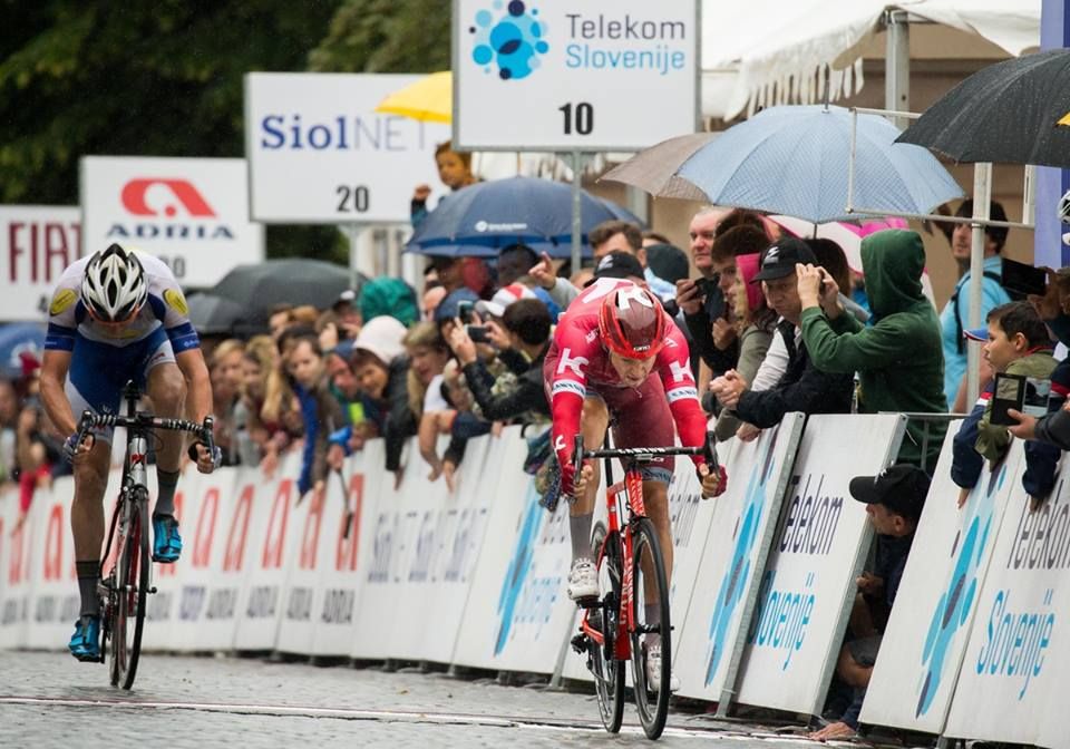 Alexander Porsev throws his wheel over the line for the final stage win