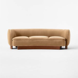 camel colored curved sofa