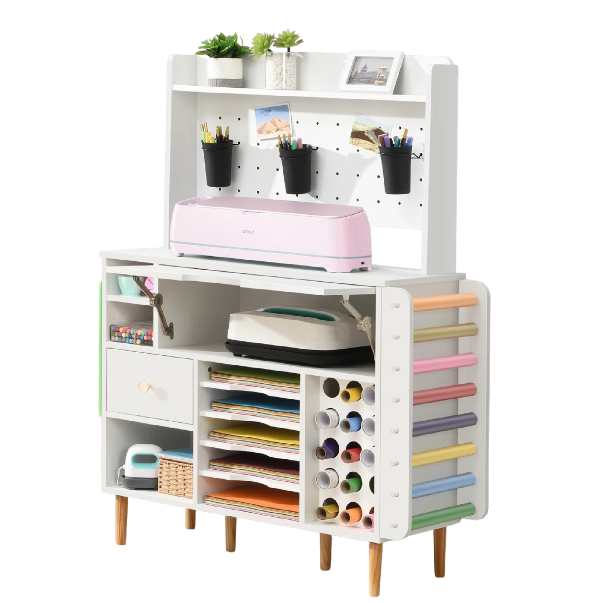crafting desk complete with several drawers, rolls of paper, a peg board, and pens and pencils
