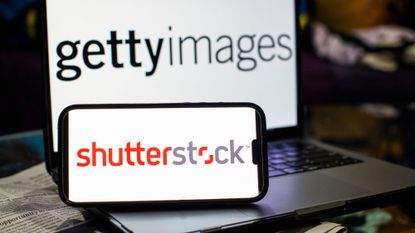 The Shutterstock and Getty Images logos are seen on a pair of computer and phone screens.