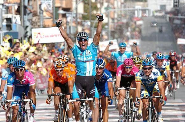 Petacchi celebrates along with team-mate Erik Zabel in the background