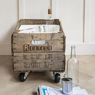Upcycled wooden crate used to store recycling