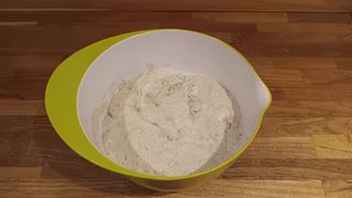 Ingredients mixed for no-knead dough in a mixing bowl