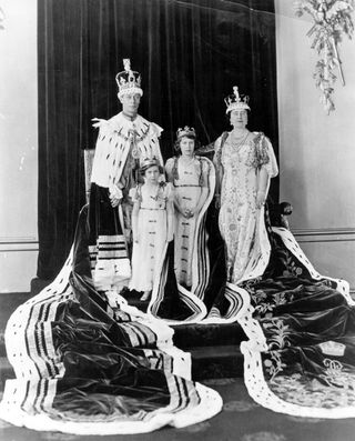 King George VI, Queen Elizabeth (later The Queen Mother), Princess Elizabeth, and Princess Margaret in their Coronation robes, 1937