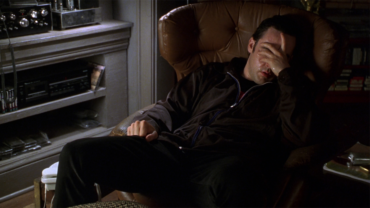 John Cusack as Rob Gordon sad and wet in High Fidelity