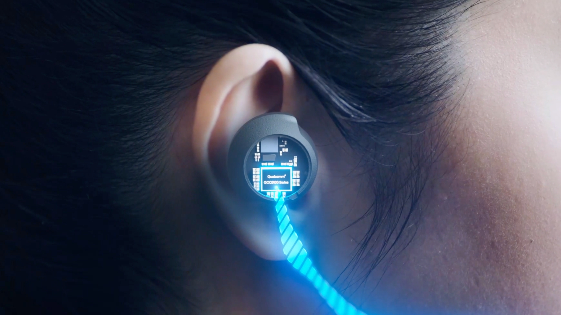 Qualcomm Snapdragon Sound embedded in an earbud, worn in a woman's ear