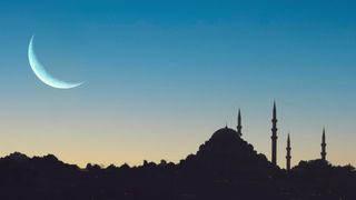 Ramadan moon in front of mosque in turkey