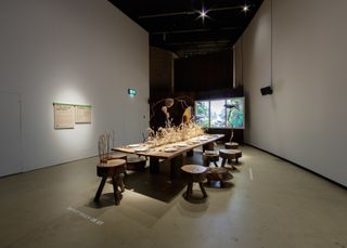 Table style exhibit at Barbican's Our Time On Earth exhibition