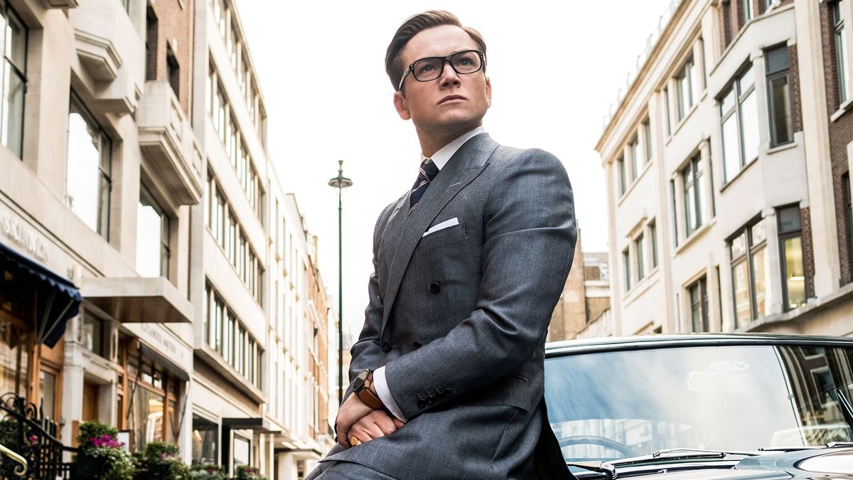 Taron Egerton's Eggsy sit on a car in Kingsman: The Golden Circle