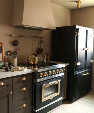 A kitchen counter, oven and refrigerator