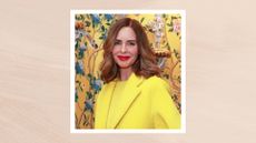 Image of Trinny Woodall with curled brunette hair, wearing red lipstick and a bright red lipstick, on a neutral background