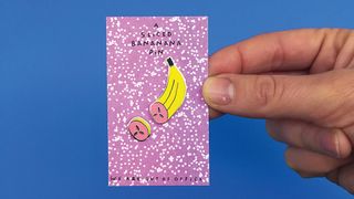 Sliced banana pin on printed packaging