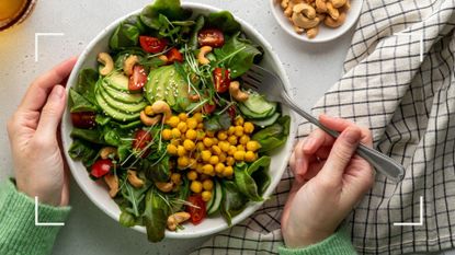 Woman holding a big bowl of high protein and high fiber salad to avoid making the common weight loss mistakes