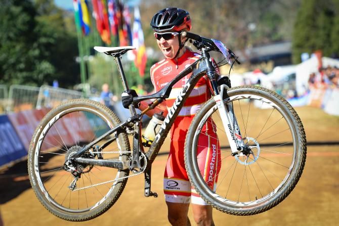 Annika Langvad of Denmark claimed her third world title of her career when she won the women's race of the UCI MTB Marathon World Championships on Sunday.