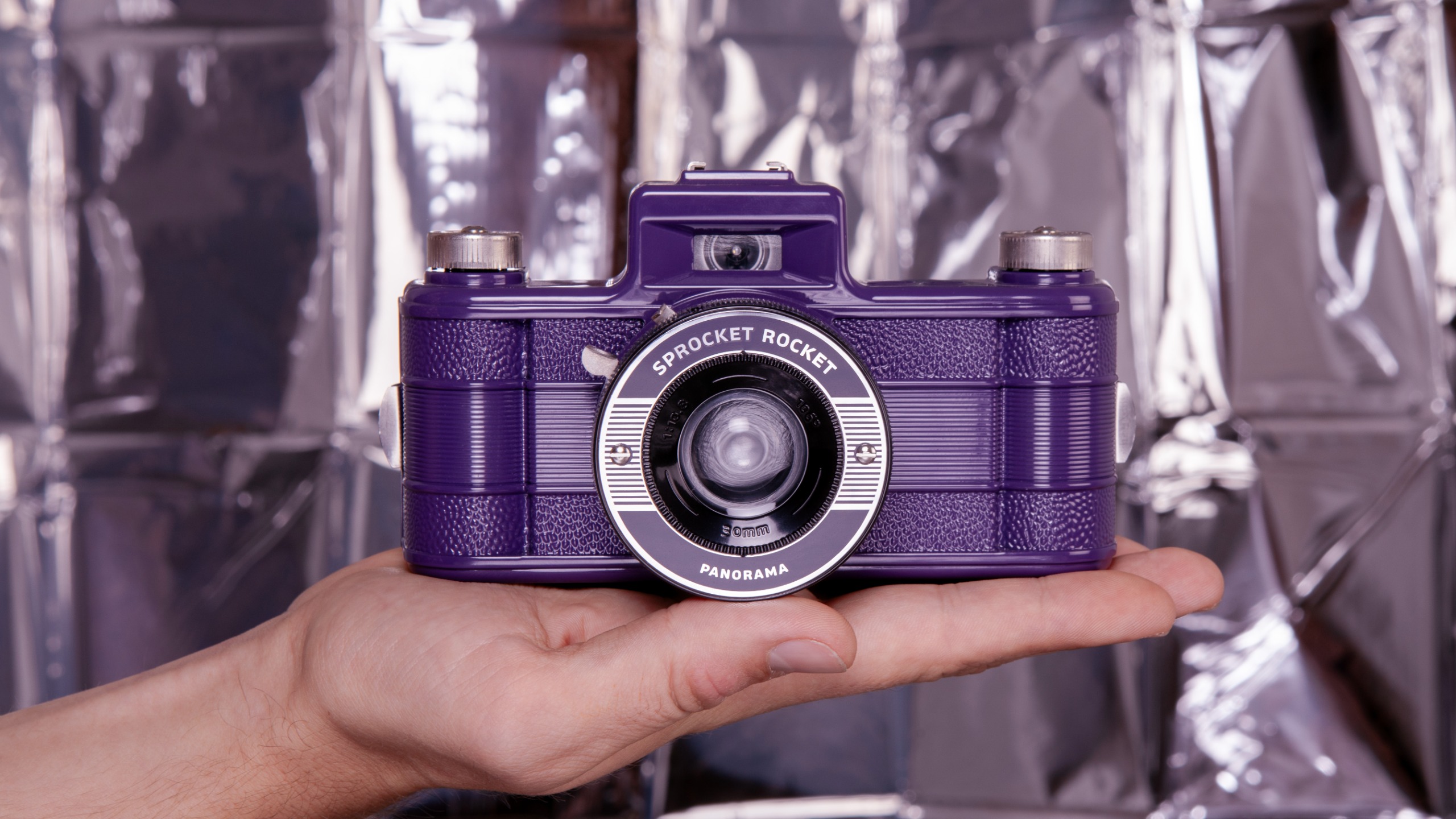 The Lomography Sprocket Rocket in a person's hands