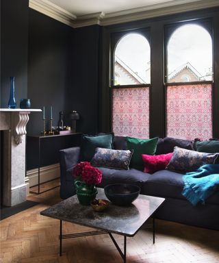 dark painted living room with rich jewel toned furniture