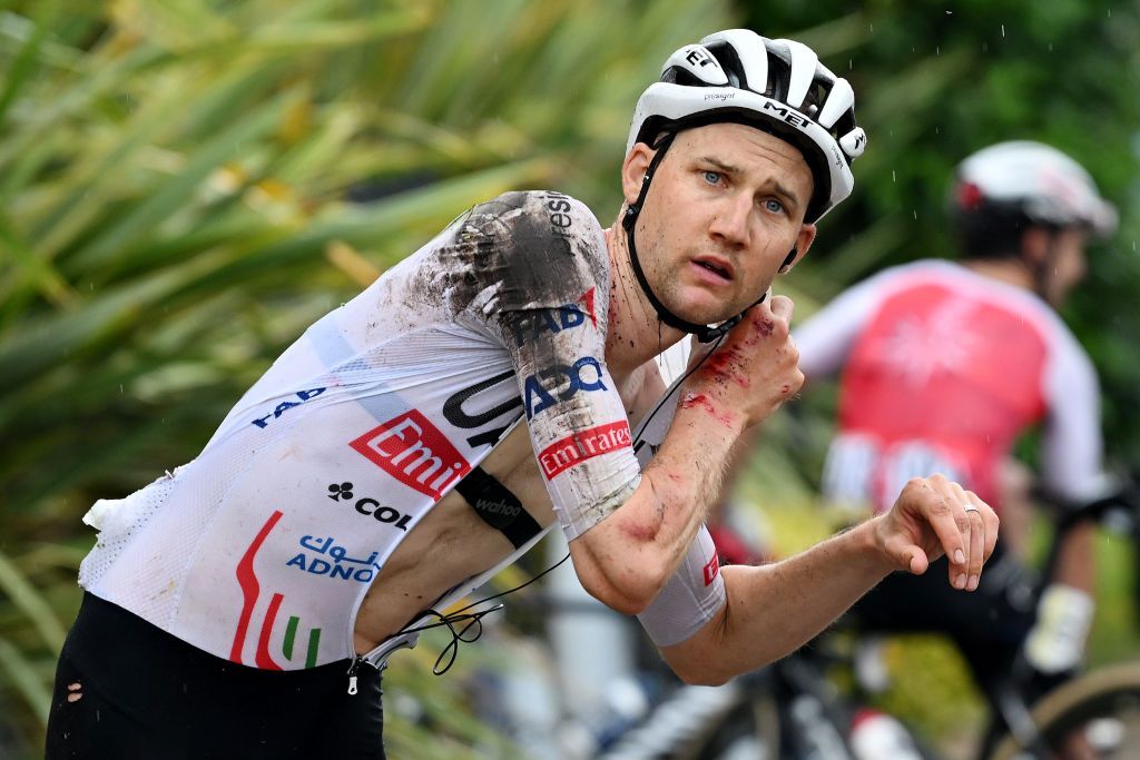 BOISSETSAINTPRIEST FRANCE JUNE 06 EDITORS NOTE Image depicts graphic contentTim Wellens of Belgium and UAE Team Emirates injured after falling after the neutralization of the race due to a multiple fall during the 76th Criterium du Dauphine 2024 Stage 5 a 167km stage from Amplepuis to SaintPriest UCIWT on June 06 2024 in BoissetSaintPriest France Photo by Dario BelingheriGetty Images