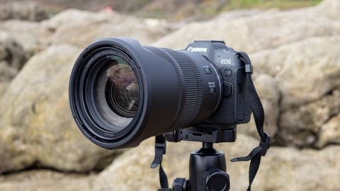 Canon EOS R8 camera on a tripod with rocky background
