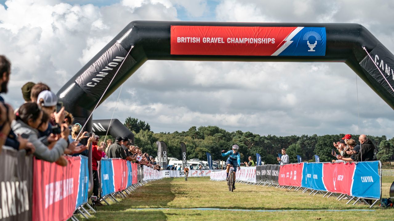 Image shows Tiffany Keep celebrating as she wins the King&#039;s Cup Gravel race.