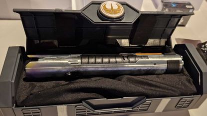 Master Sol Legacy Lightsaber hilt in a case with a High Republic Jedi symbol