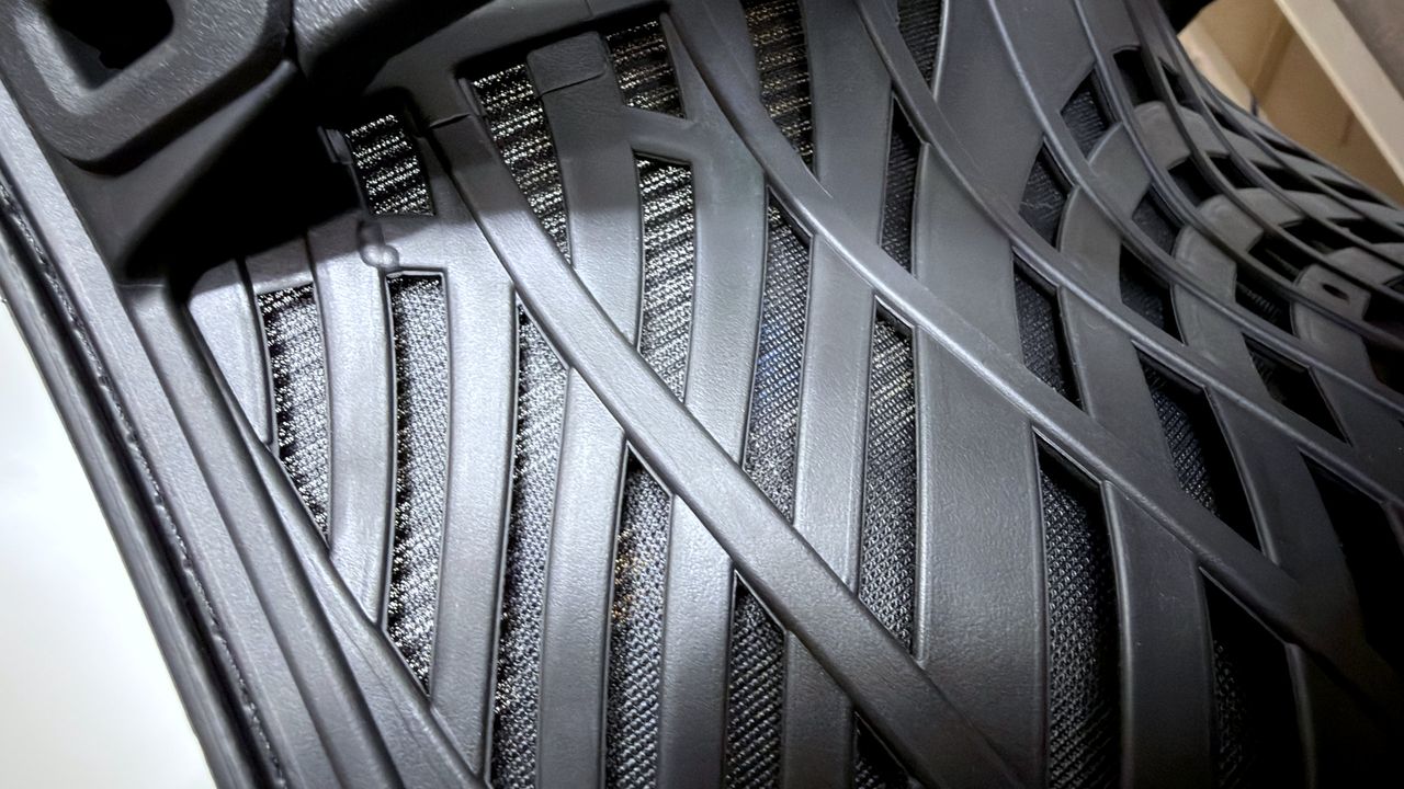 A photo of an Autonomous ErgoChair Ultra 2, showing a close-up view of the polymer mesh used in the back