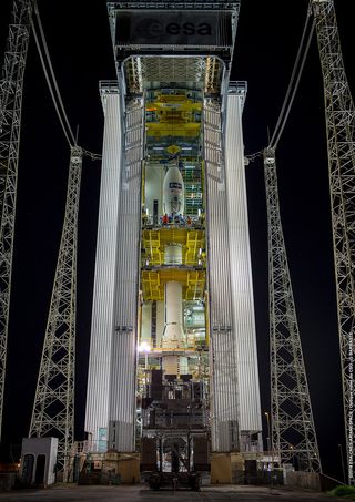 The Arianespace Vega rocket, with the Aeolus satellite on top, stands in the launch tower at Europe’s spaceport in Kourou, French Guiana.