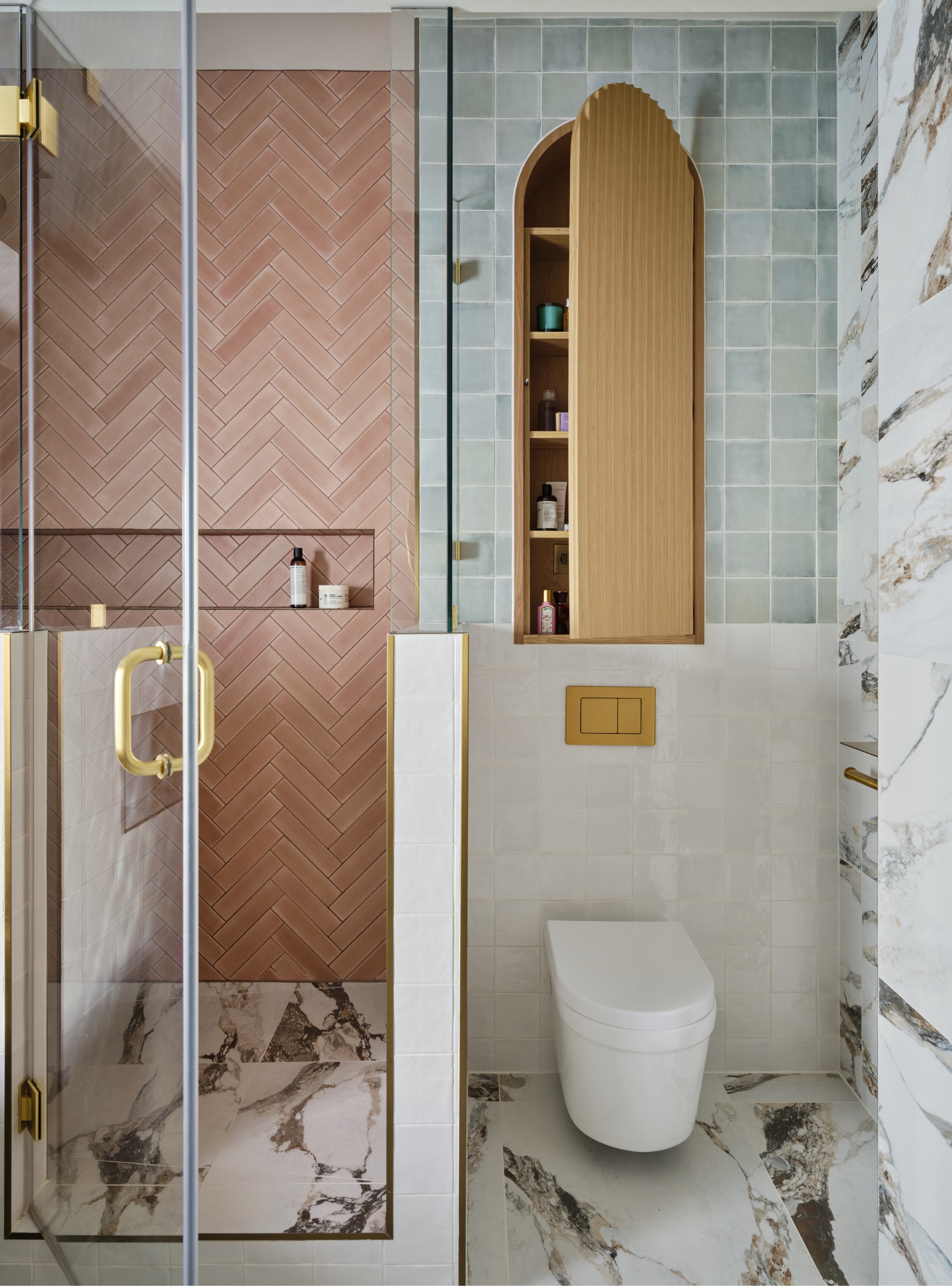 Green and pink bathroom with with hidden cabinet