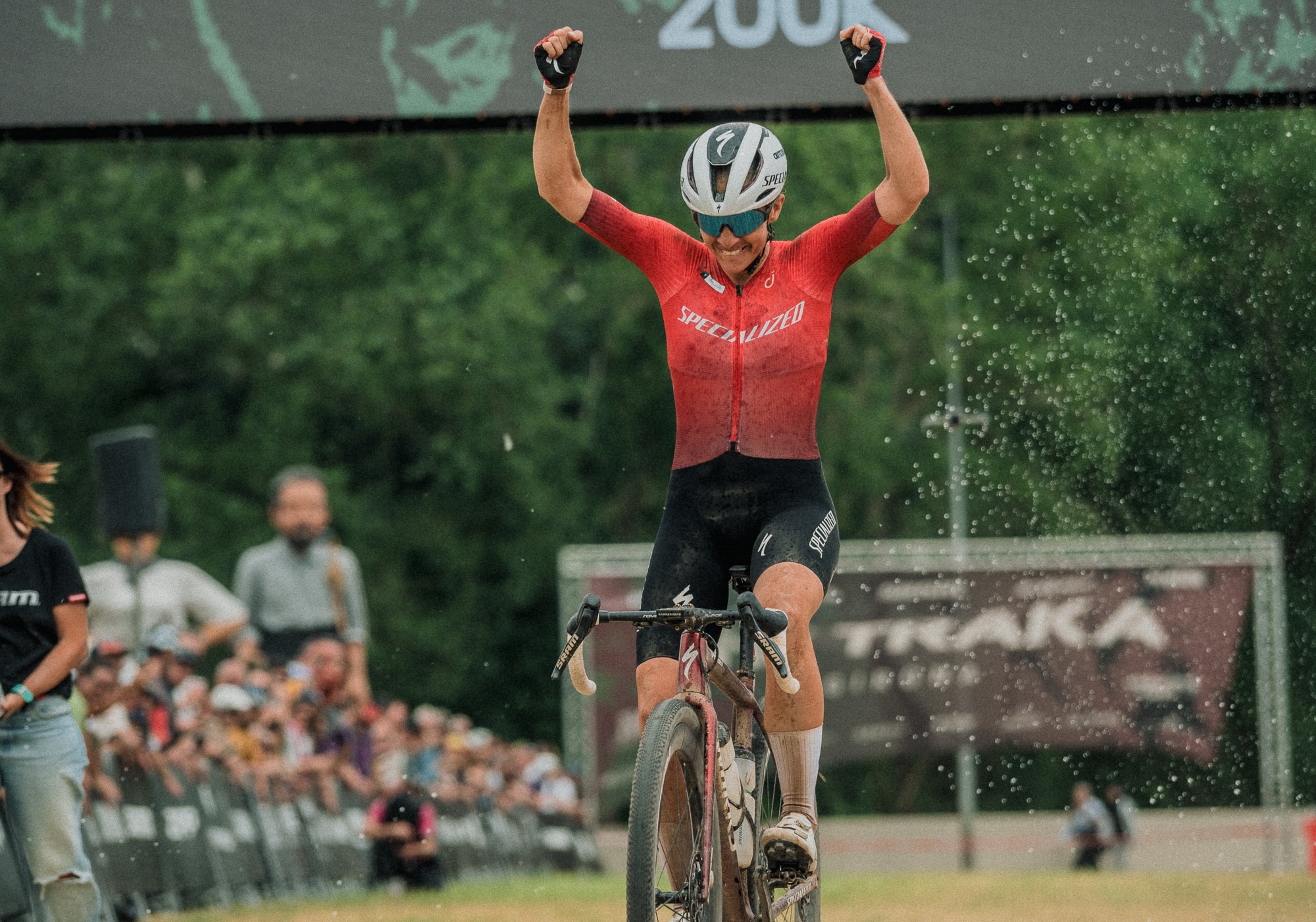 Sofia Gomez Villafane raises her arms as she crosses the finish line at The Traka