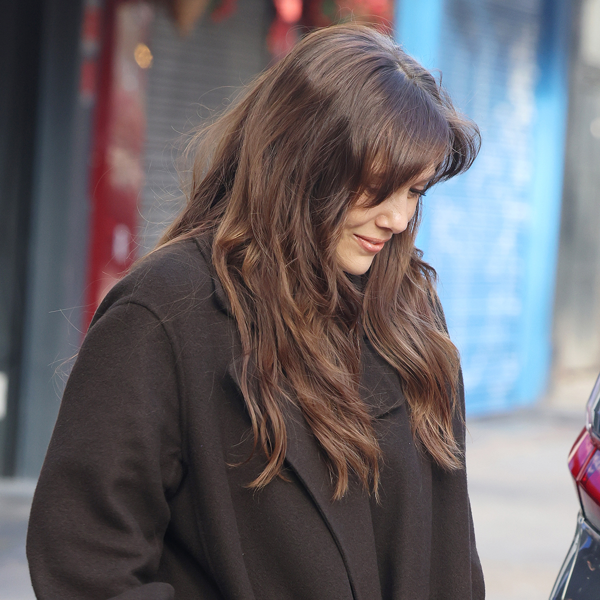 Elizabeth Olsen wearing an oversized brown wool coat