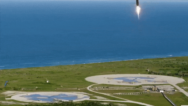 two rocket boosters coming in for a landing